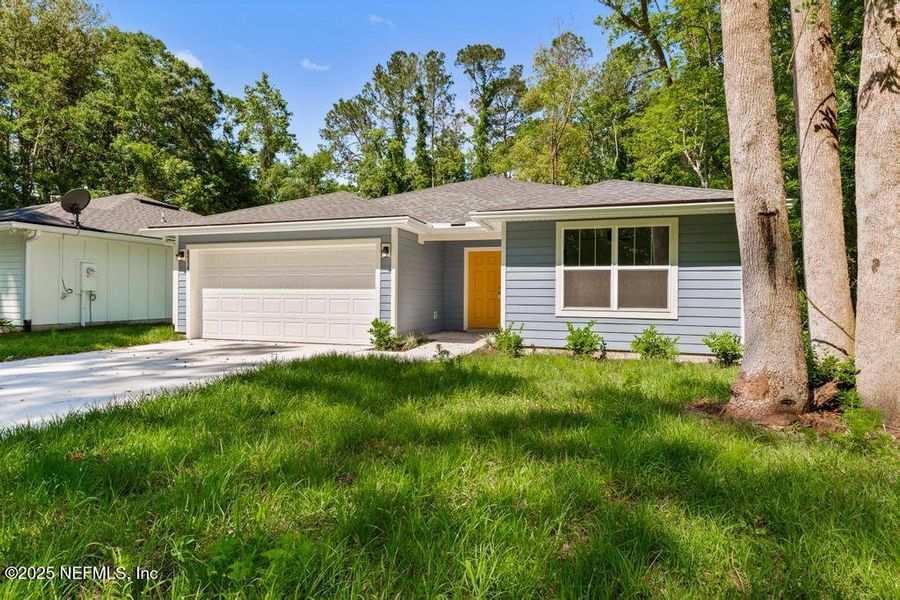 Front exterior of a new home in , Jacksonville, FL, highlighting curb appeal (Image 19).