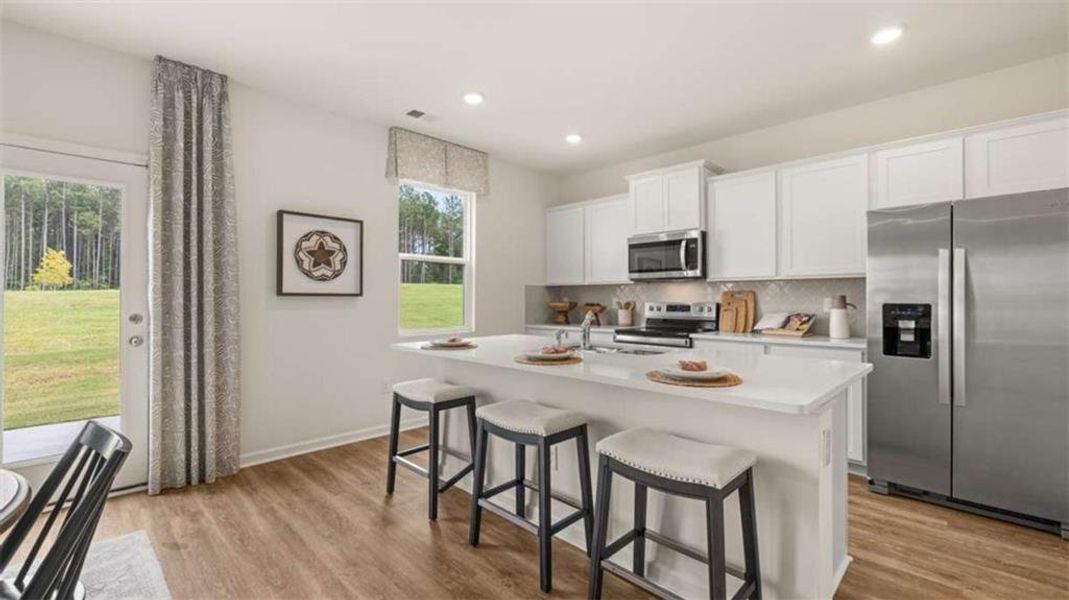 Furnished interior view inside a new home in Oakchase at Hampton, Hampton (Image 11).