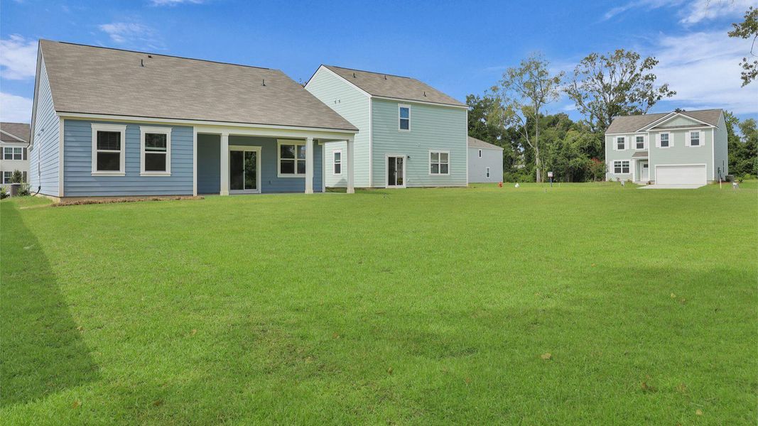 Front exterior of a new home in Lakeview at Kitfield, Moncks Corner, SC, highlighting curb appeal (Image 2). Front exterior of a new home in Lakeview at Kitfield, Moncks Corner, SC, highlighting curb appeal (Image 2).