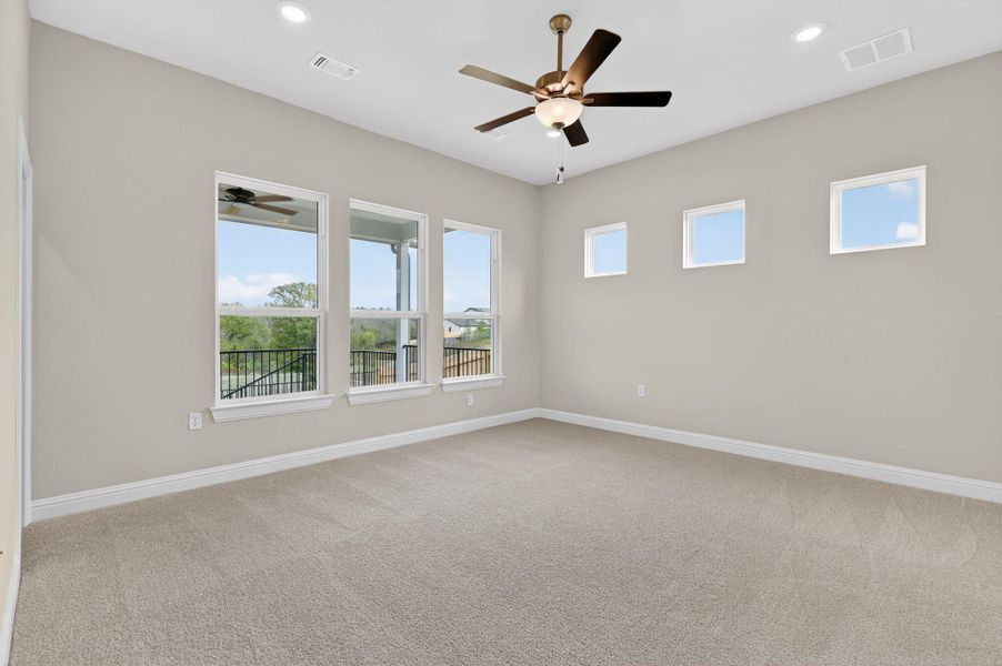 Empty room featuring light carpet, recessed lighting, and ceiling fan