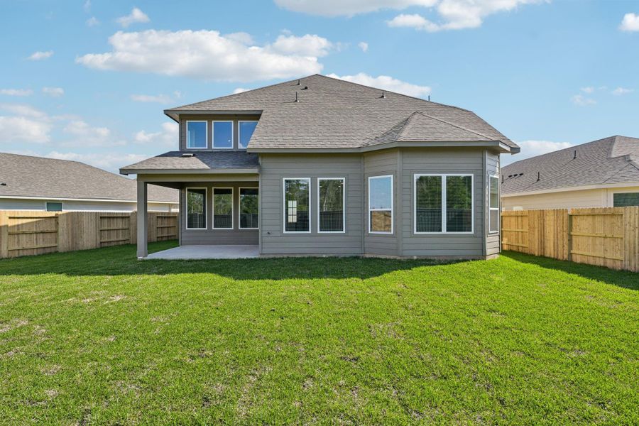 Exterior details and patio area of a home in Riviera Pines - Classic Series, Huffman (Image 3).