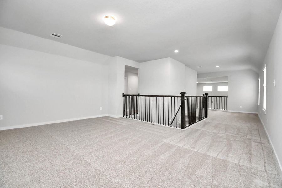 Loft can be a flex space or additional living area. Sample photo of completed home with similar floor plan. Actual colors and selections may vary.