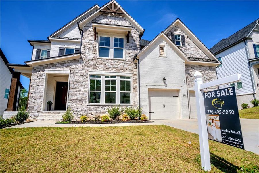 Front exterior of a new home in , Woodstock, GA, highlighting curb appeal (Image 22).