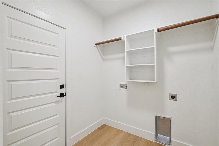 Laundry room with light wood-type flooring, electric dryer hookup, and washer hookup