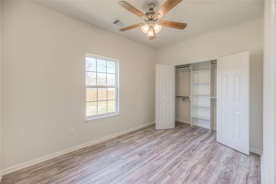 Master bedroom with his and hers closet.