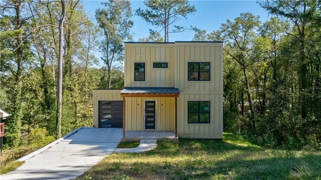 Front exterior of a new home in , Hapeville, GA, highlighting curb appeal (Image 10).