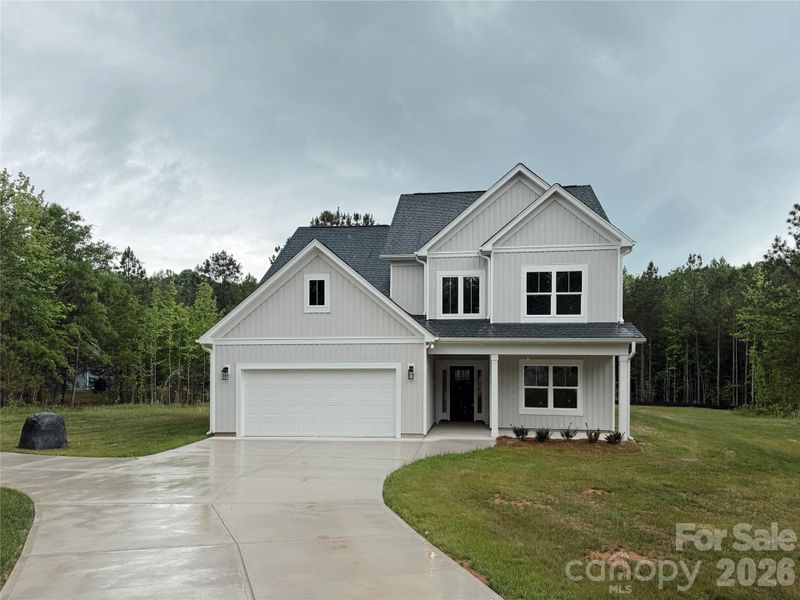 Front exterior of a new home in , Clover, SC, highlighting curb appeal (Image 6).