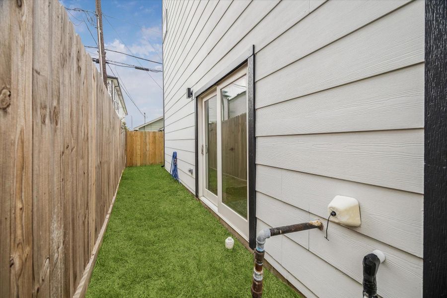Fenced side yard gives you grass, a hose bib, and a spot for the grill. Sliding door drops you out there straight from the living space. Fenced side yard gives you grass, a hose bib, and a spot for the grill. Sliding door drops you out there straight from the living space.