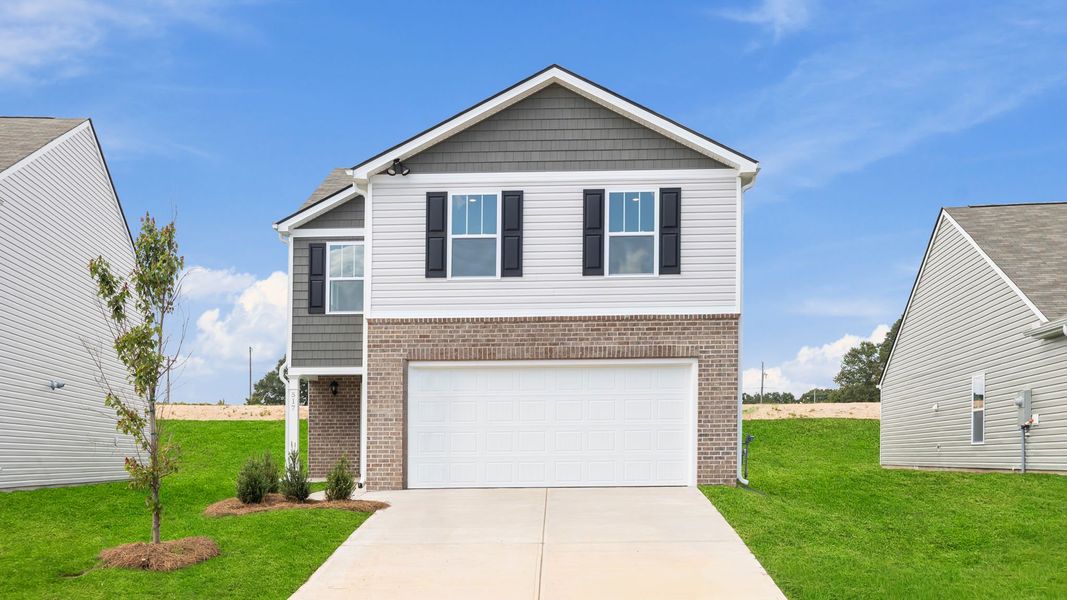 Front exterior of a new home in Durbin Meadows, Fountain Inn, SC, highlighting curb appeal (Image 1).