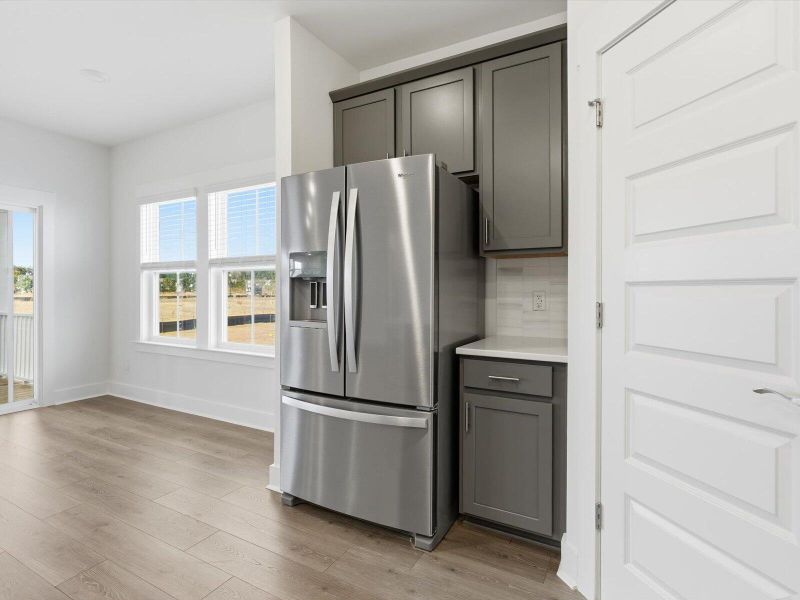 Furnished interior view inside a new home in The Coves at Lakes of Cane Bay, Summerville (Image 7).