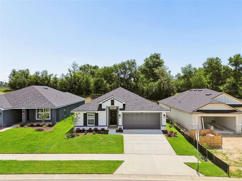 Front exterior of a new home in Abbey Glen, Dade City, FL, highlighting curb appeal (Image 37). Front exterior of a new home in Abbey Glen, Dade City, FL, highlighting curb appeal (Image 37).