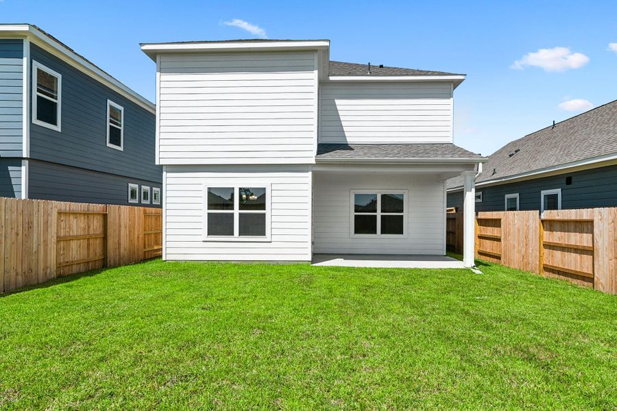 Front exterior of a new home in The Canopies, Splendora, TX, highlighting curb appeal (Image 13).