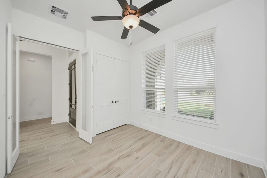 Representative unfurnished interior of a home built from the Bonneville by Chesmar Homes in Meridiana 50's and 60's, Manvel (Image 21).