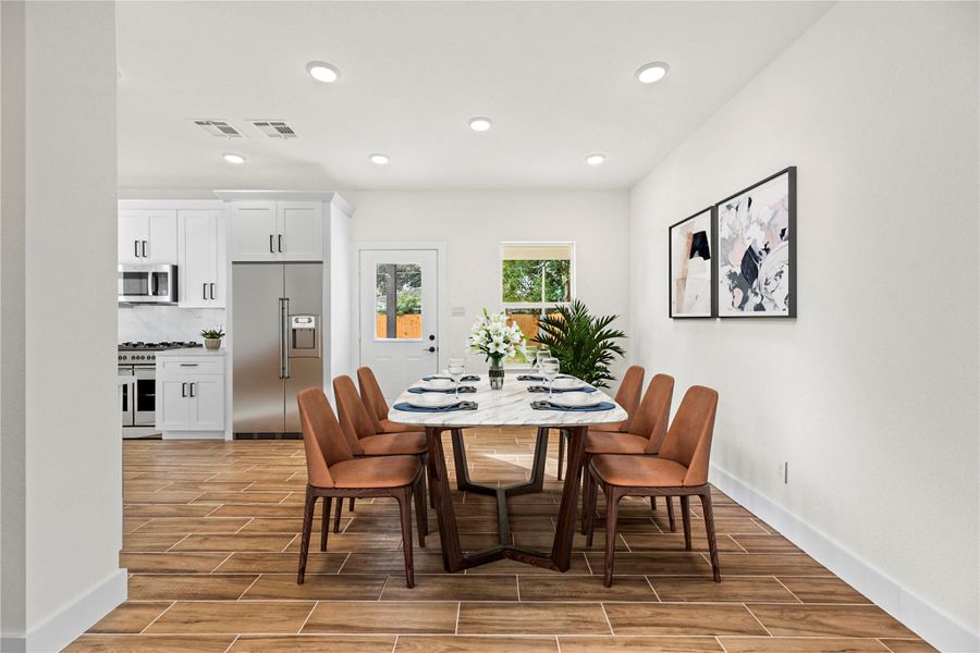 Imagine having a complete breakfast of pancakes and eggs in the eat-in kitchen. Durable tile flooring ensures quick and easy cleanup if there should be a dining mishap! *Virtually staged photo* Imagine having a complete breakfast of pancakes and eggs in the eat-in kitchen. Durable tile flooring ensures quick and easy cleanup if there should be a dining mishap! *Virtually staged photo*
