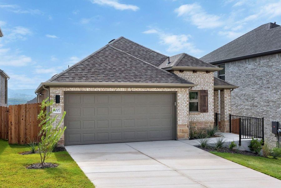 Front exterior of a new home in Lakeside at Tessera, Lago Vista, TX, highlighting curb appeal (Image 2). Front exterior of a new home in Lakeside at Tessera, Lago Vista, TX, highlighting curb appeal (Image 2).