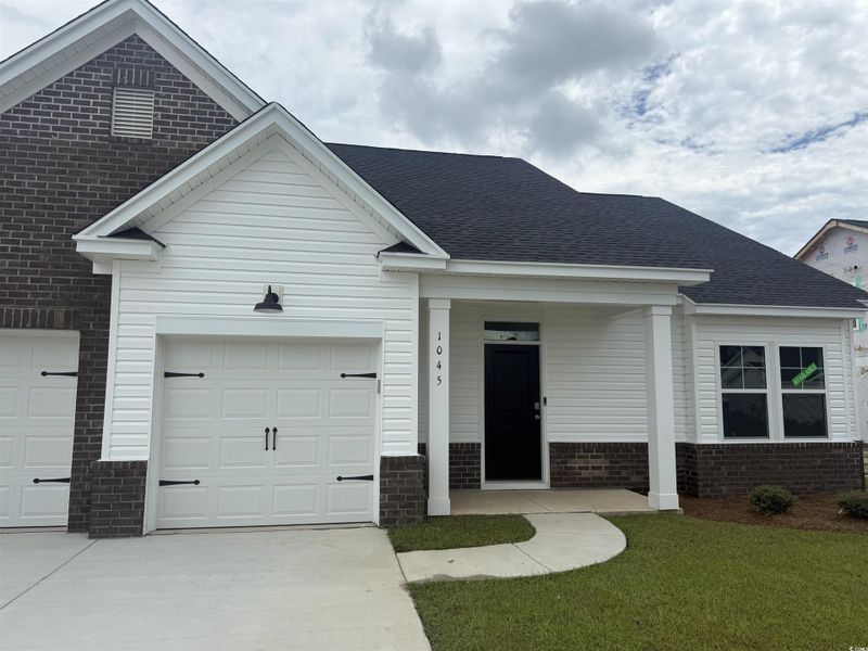 Front exterior of a new home in Avery Woods, Longs, SC, highlighting curb appeal (Image 2).