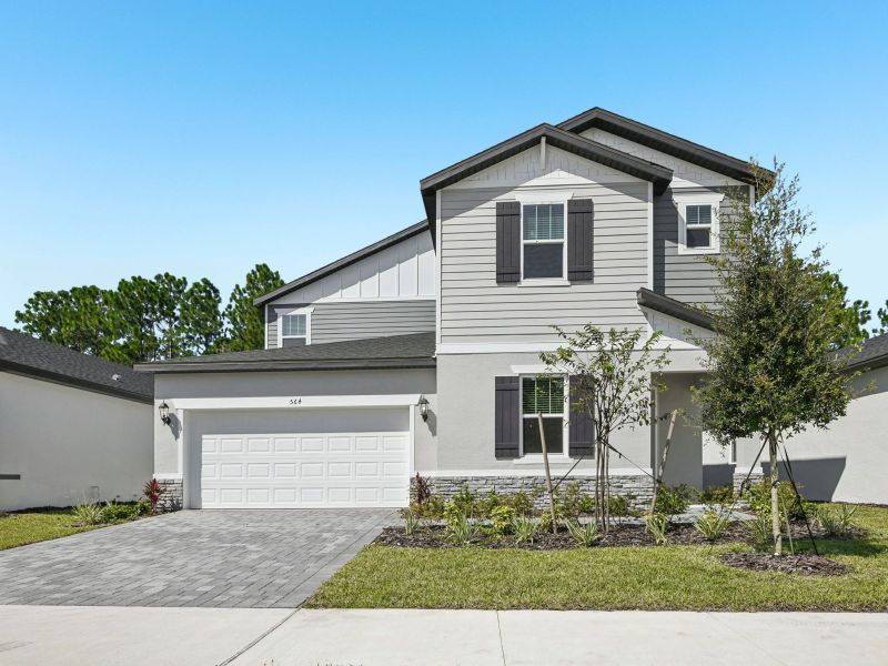 Front exterior of a home in the Ridgehaven - Signature Series community, located in Ormond Beach, FL (Image 8). Front exterior of a home in the Ridgehaven - Signature Series community, located in Ormond Beach, FL (Image 8).