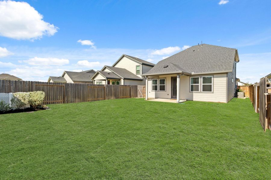 There is plenty of greenspace to enjoy! The sellers added custom landscaping and fencing!