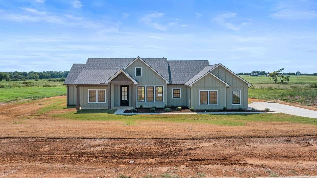 Front exterior of a new home in , Whitesboro, TX, highlighting curb appeal (Image 24).