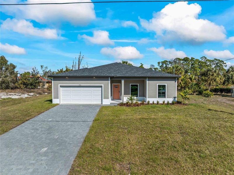 Front exterior of a new home in , North Port, FL, highlighting curb appeal (Image 24).