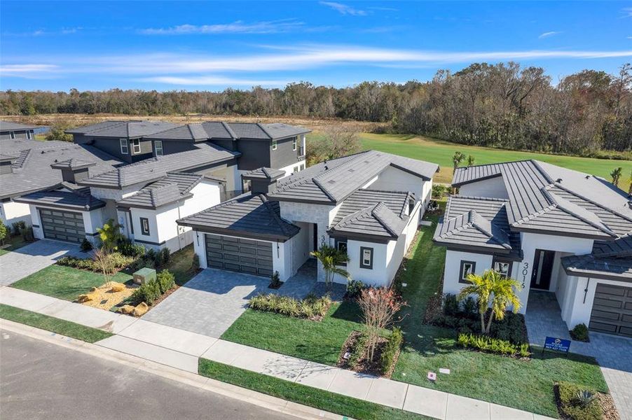 Front exterior of a new home in Hampton Green at Providence, Davenport, FL, highlighting curb appeal (Image 29).