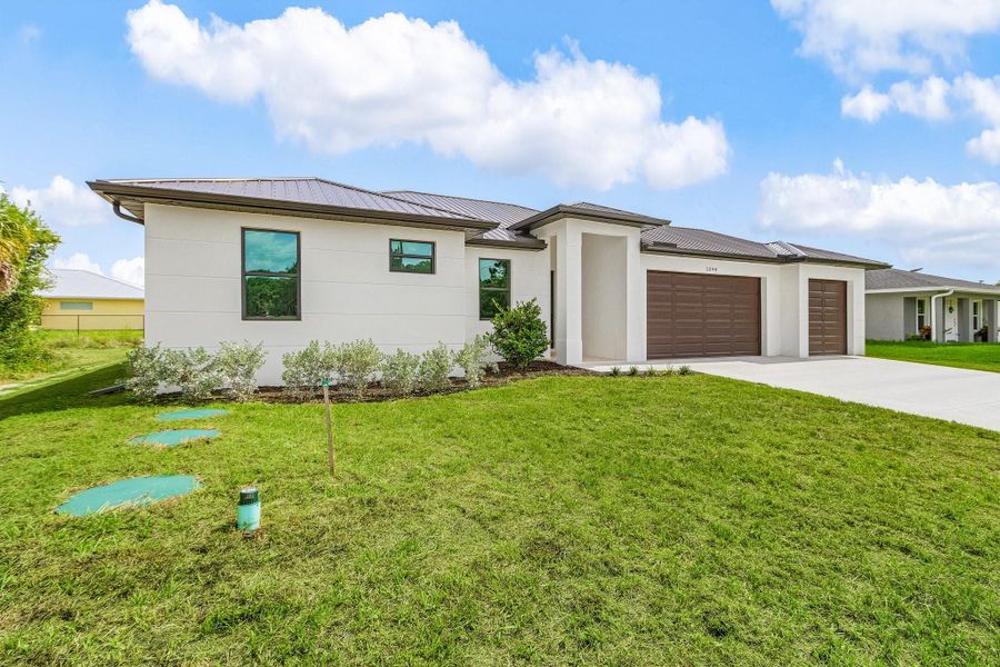 Front exterior of a new home in , Labelle, FL, highlighting curb appeal (Image 18). Front exterior of a new home in , Labelle, FL, highlighting curb appeal (Image 18).