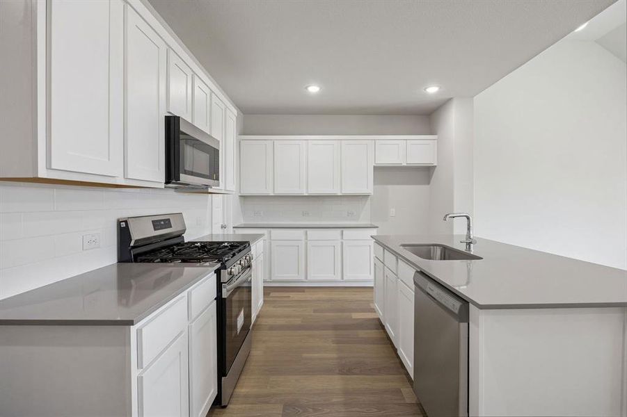 Kitchen in the Masters home plan by Trophy Signature Homes – REPRESENTATIVE PHOTO Kitchen in the Masters home plan by Trophy Signature Homes – REPRESENTATIVE PHOTO