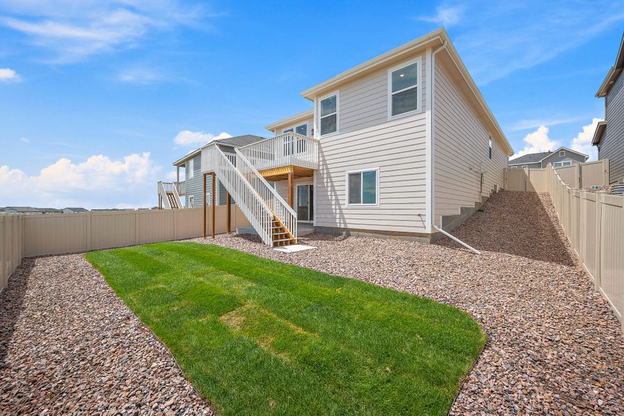 Front exterior of a new home in Trails at Aspen Ridge-3, Colorado Springs, CO, highlighting curb appeal (Image 21). Front exterior of a new home in Trails at Aspen Ridge-3, Colorado Springs, CO, highlighting curb appeal (Image 21).