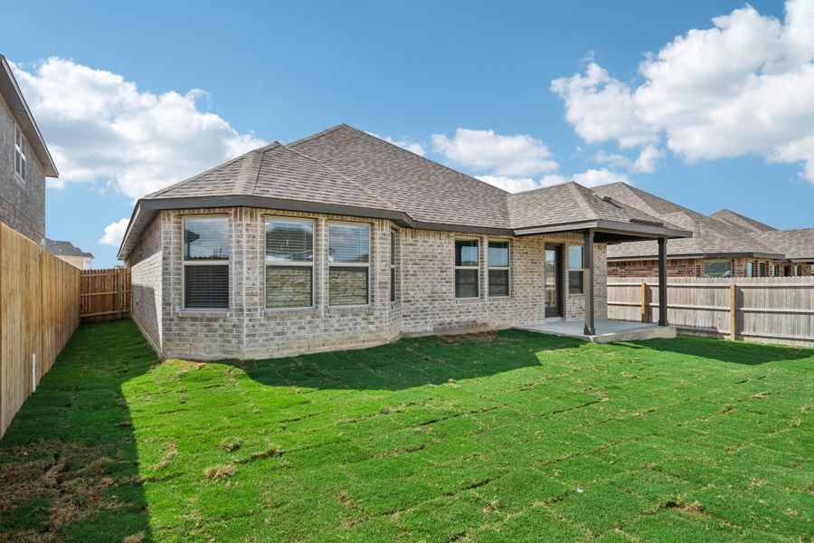 Back exterior of the the FItzhugh floorplan in a Meritage Homes community.