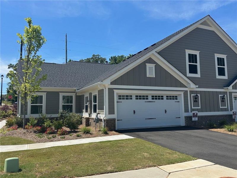 Front exterior of a new home in , Cumming, GA, highlighting curb appeal (Image 18).
