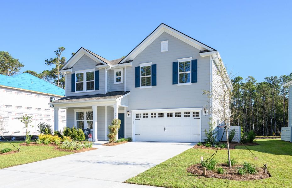 Front exterior of a new home in Waterways, Richmond Hill, GA, highlighting curb appeal (Image 27). Front exterior of a new home in Waterways, Richmond Hill, GA, highlighting curb appeal (Image 27).