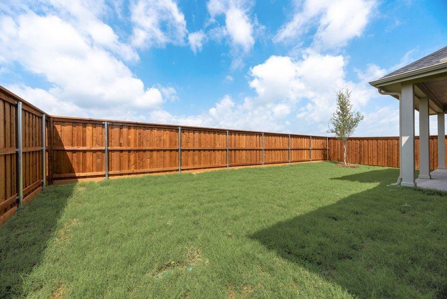 Exterior details and patio area of a home in Spiritas Ranch, Little Elm (Image 3).