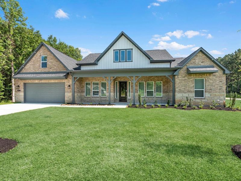 Front exterior of a new home in , Dayton, TX, highlighting curb appeal (Image 1).