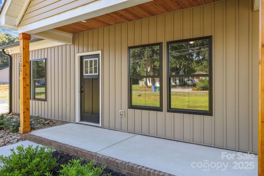 Front exterior of a new home in , Albemarle, NC, highlighting curb appeal (Image 21).