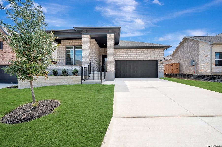 Front exterior of a new home in Windsong - Reserve Series, Boerne, TX, highlighting curb appeal (Image 2). Front exterior of a new home in Windsong - Reserve Series, Boerne, TX, highlighting curb appeal (Image 2).