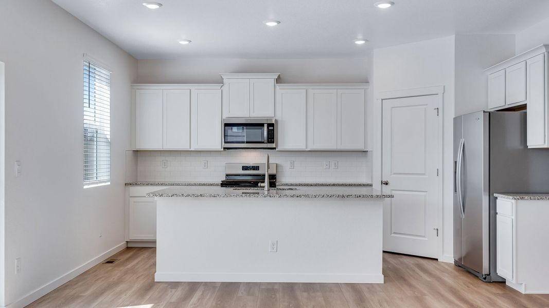 Furnished interior view inside a new home in Trails at Crowfoot, Parker (Image 5).
