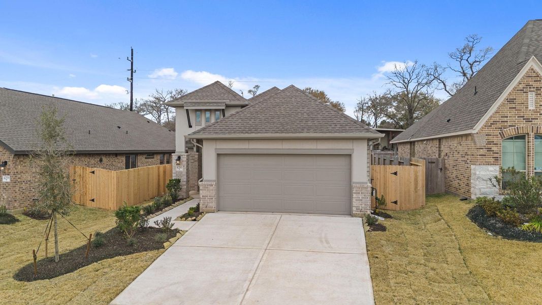 Front exterior of a new home in Escondido, Magnolia, TX, highlighting curb appeal (Image 20).