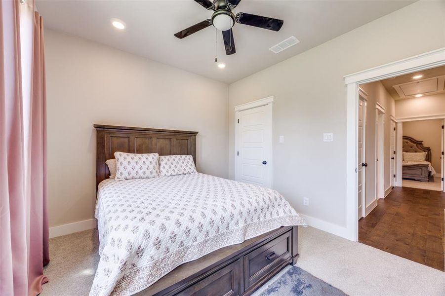 Bedroom featuring recessed lighting, attic access, carpet floors, and a ceiling fan
