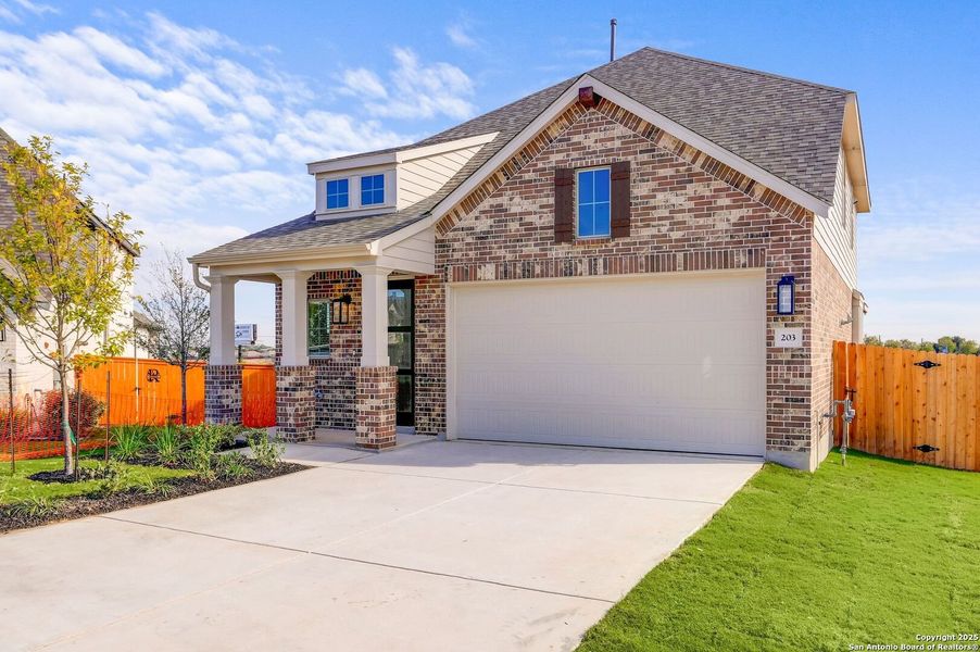 Front exterior of a new home in Legacy at Lake Dunlap, New Braunfels, TX, highlighting curb appeal (Image 2).
