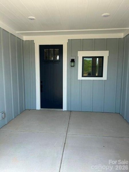 Exterior details and patio area of a home in The Courtyards at Hodges Farm, Charlotte (Image 3).