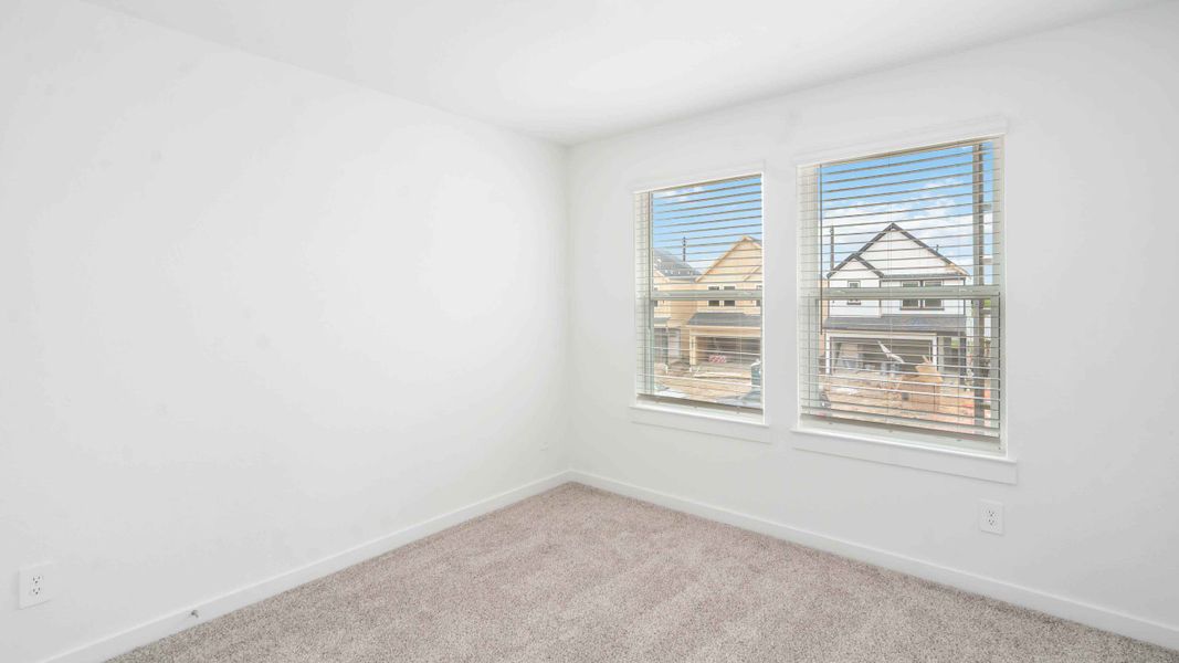 Representative unfurnished interior of a home built from the Jasmine by D.R. Horton in City Gate North, Houston (Image 9).