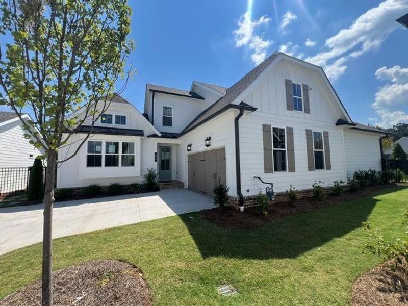 Front exterior of a new home in Promenade at Sawnee Village, Cumming, GA, highlighting curb appeal (Image 16).