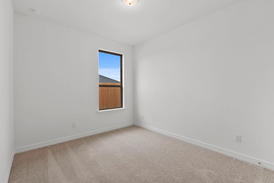 Secondary bedroom.  Sample product photo. Actual exterior and interior selections may vary by homesite. Photo may be virtually staged.