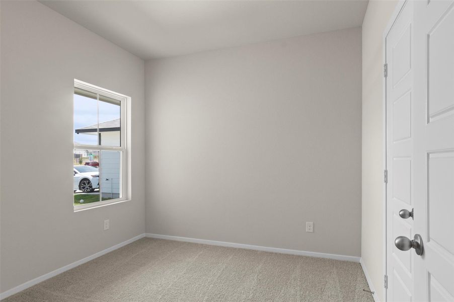 Empty room featuring light carpet and baseboards Empty room featuring light carpet and baseboards