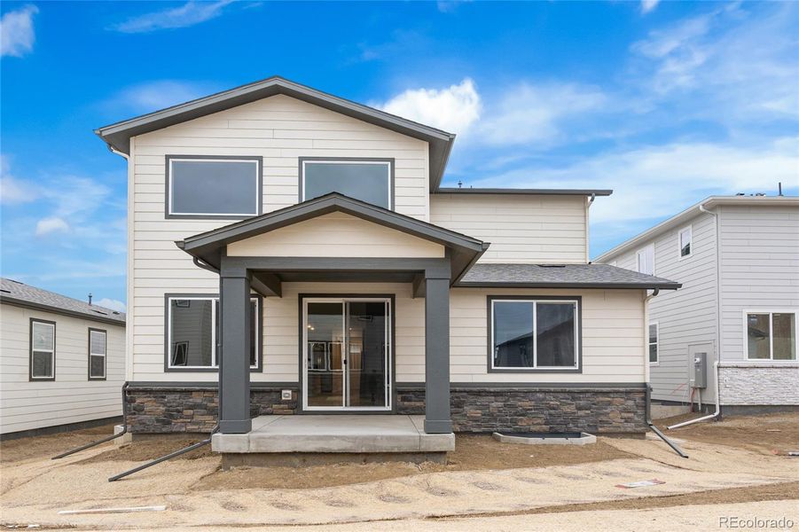 Exterior details and patio area of a home in Harvest Crossing, Aurora (Image 14).