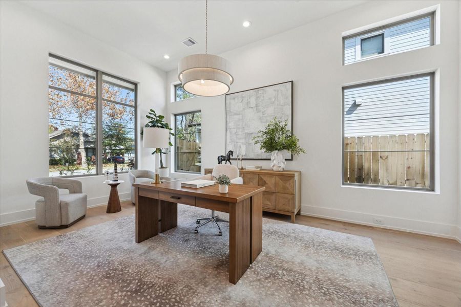 Bright and versatile room at the front of the house is ideal for a formal dining room or a home office.