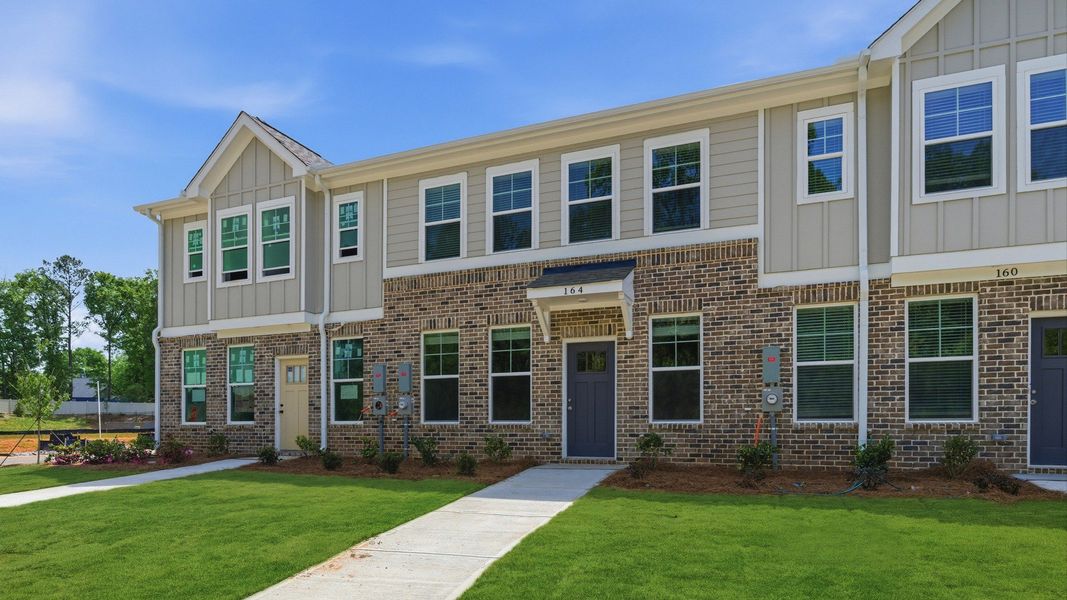 Front exterior of a new home in Avery Landing, McDonough, GA, highlighting curb appeal (Image 20).