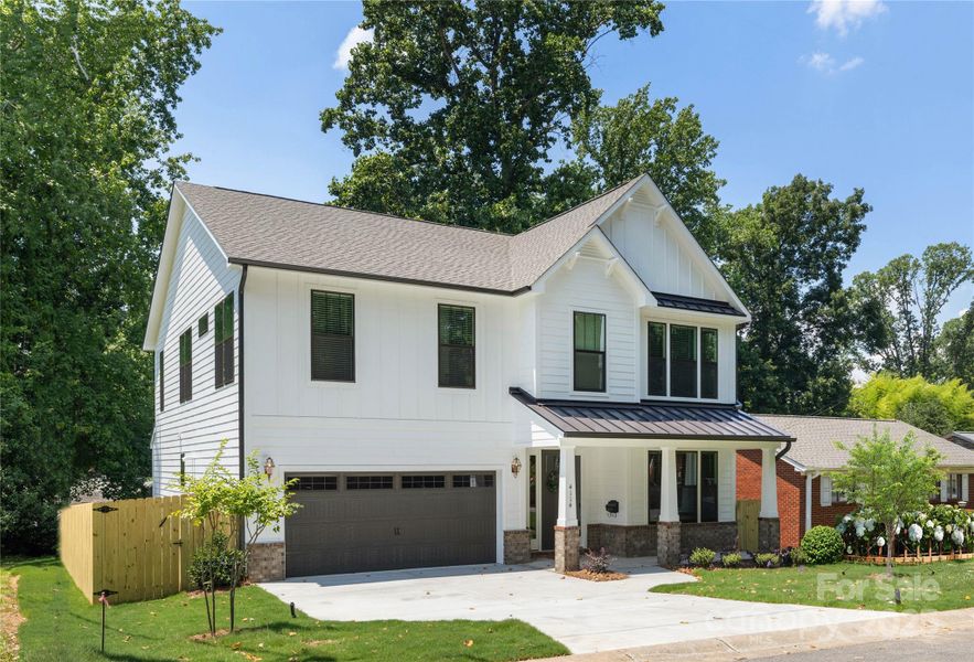 Front exterior of a new home in , Charlotte, NC, highlighting curb appeal (Image 1).