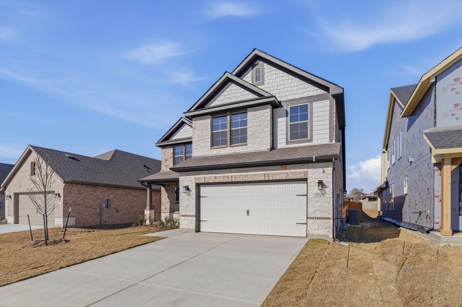 Front exterior of a new home in Liberty Pointe, Gainesville, TX, highlighting curb appeal (Image 16). Front exterior of a new home in Liberty Pointe, Gainesville, TX, highlighting curb appeal (Image 16).