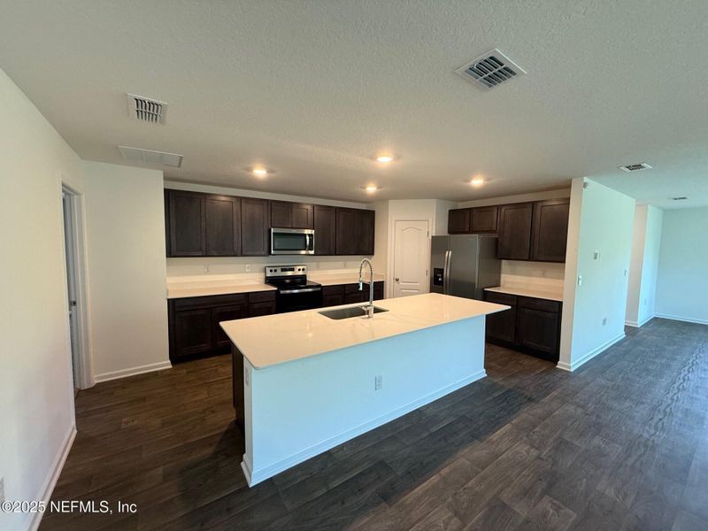 Furnished interior view inside a new home in Sawmill Branch Express, Palm Coast (Image 13). Furnished interior view inside a new home in Sawmill Branch Express, Palm Coast (Image 13).